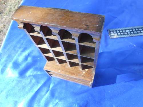 Doll`s house furniture or thimble display rack.