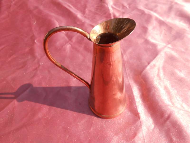Small copper jug signed by Richard Mead.  Made in Rhodesia.  130mm high.