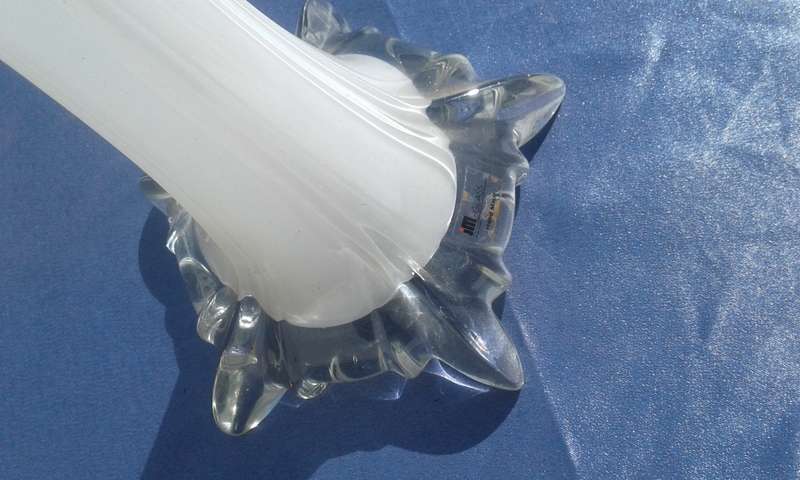 Tall (820mm) high, milk glass - lined vase.