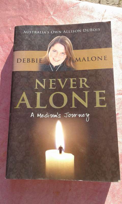 `Never Alone` Debbie Malone.  Soft cover.
