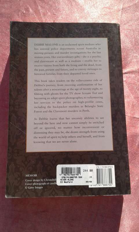 `Never Alone` Debbie Malone.  Soft cover.
