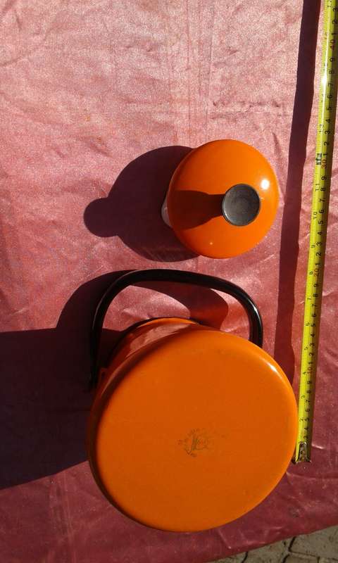 Enamel,  orange-coloured kettle.  Made in Poland.
