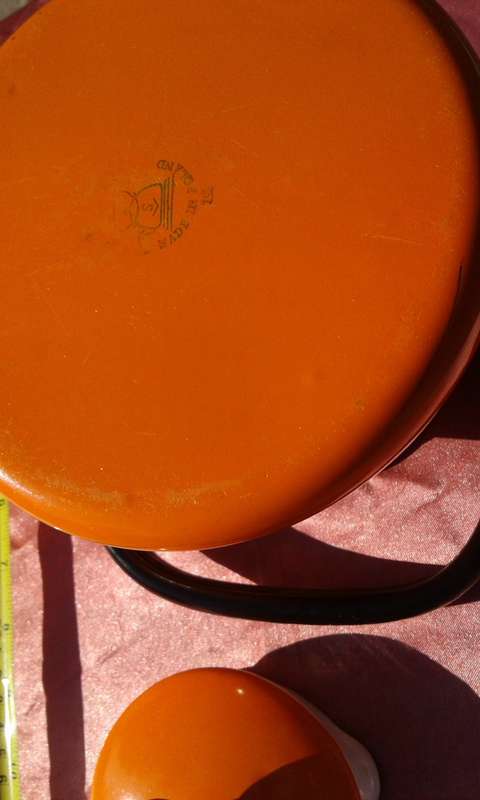 Enamel,  orange-coloured kettle.  Made in Poland.