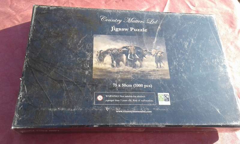 1000 piece jigsaw puzzle  Condition: Still sealed.