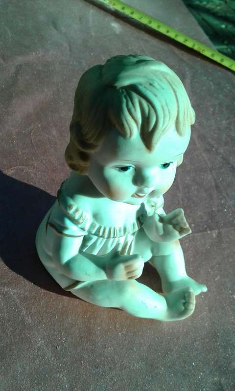 Little girl ornament.  No markings.