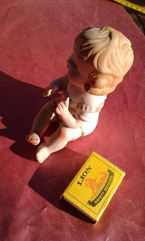 Little girl ornament.  No markings.