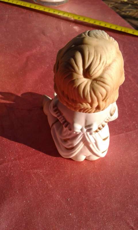 Little girl ornament.  No markings.