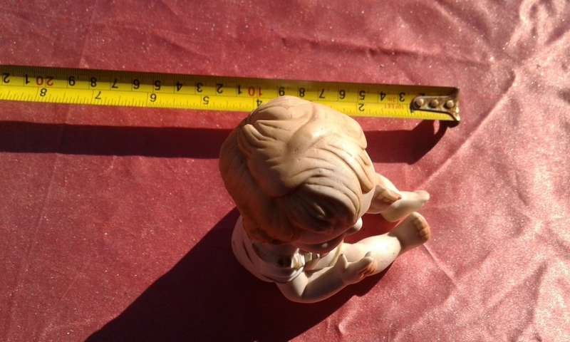 Little girl ornament.  No markings.