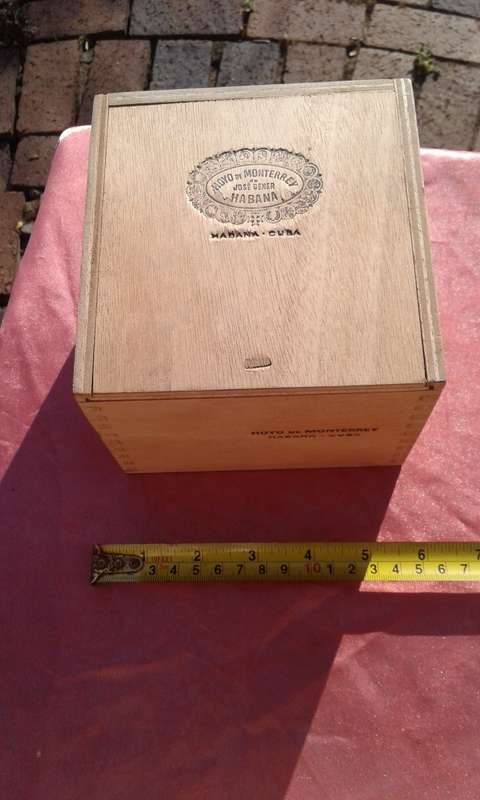 EMPTY wooden cigar boxes and cigarette tins.