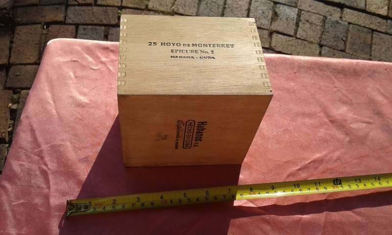 EMPTY wooden cigar boxes and cigarette tins.