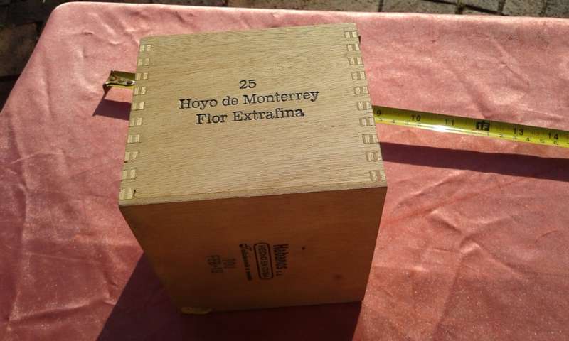 EMPTY wooden cigar boxes and cigarette tins.