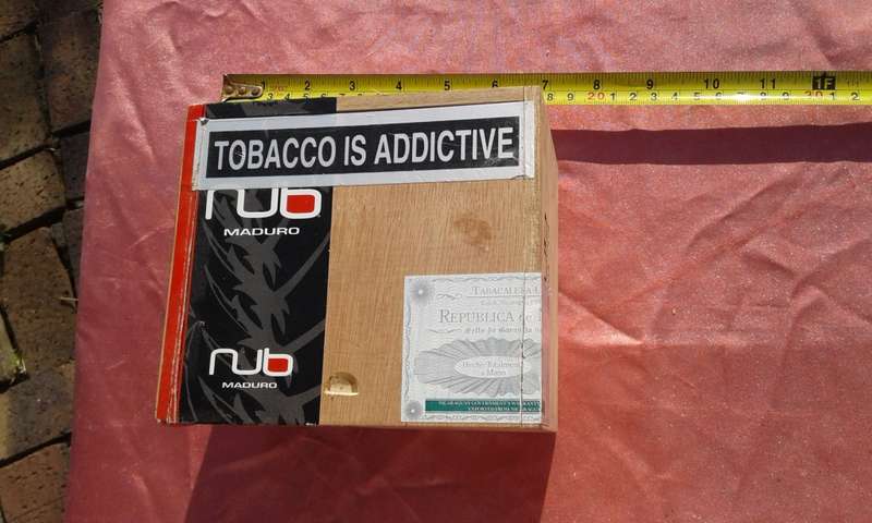 EMPTY wooden cigar boxes and cigarette tins.