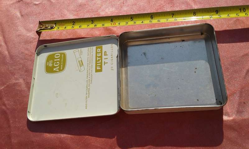 EMPTY wooden cigar boxes and cigarette tins.