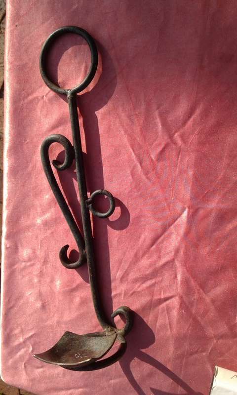 Hanging, metal candle holder.