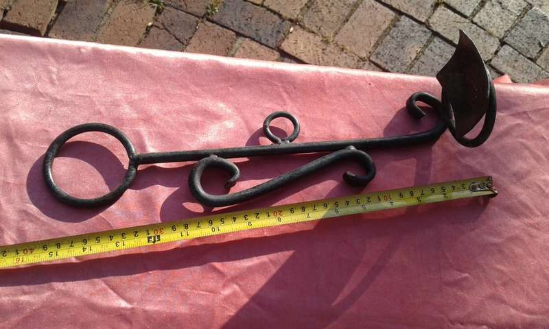 Hanging, metal candle holder.