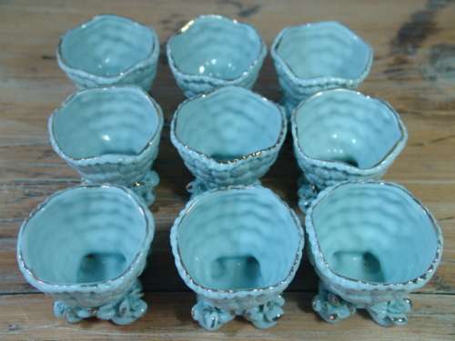 A set of 9 Vintage porcelain Egg Cups, blue with gold trim, excellent condition