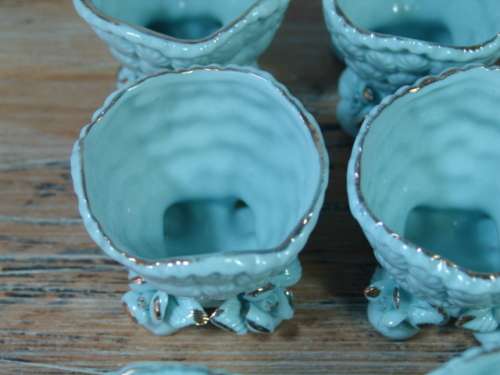 A set of 9 Vintage porcelain Egg Cups, blue with gold trim, excellent condition