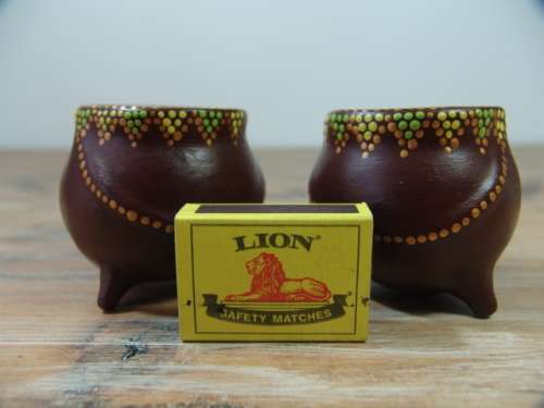A pair of Vintage small African decorated three leg Pot Ornaments