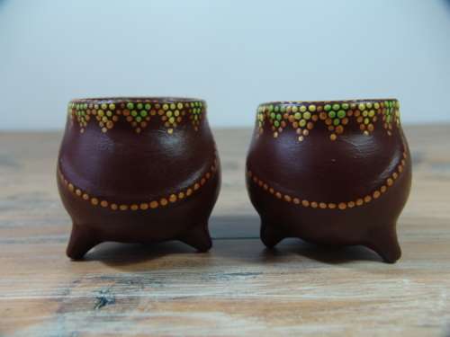 A pair of Vintage small African decorated three leg Pot Ornaments