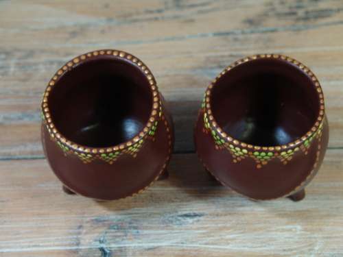 A pair of Vintage small African decorated three leg Pot Ornaments