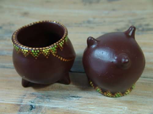 A pair of Vintage small African decorated three leg Pot Ornaments