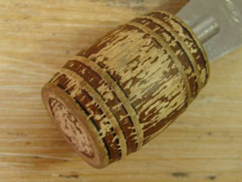 Bottle opener with barrel shaped handle