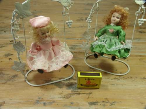 Set of two Vintage collectable rare porcelain Dolls on Swings