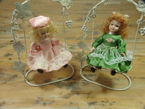 Set of two Vintage collectable rare porcelain Dolls on Swings