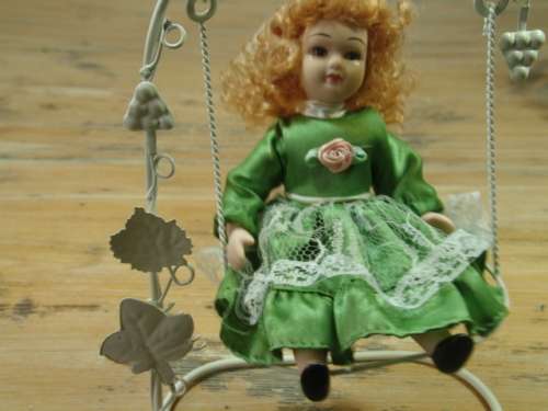Set of two Vintage collectable rare porcelain Dolls on Swings