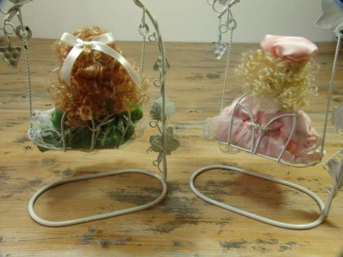 Set of two Vintage collectable rare porcelain Dolls on Swings