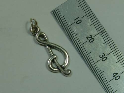 Silver tone Pendant, shaped like a music note.