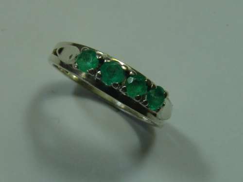 Half  eternity Sterling Silver and Emerald Ring. Total weight 3,5 grams