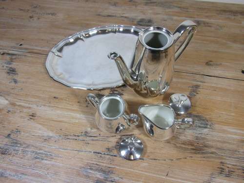 Vintage 4 piece porcelain tea set with complete and heavy silver overlay on silver plated Tray