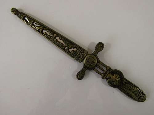 Vintage metal paper knife in the shape of a sword / dagger