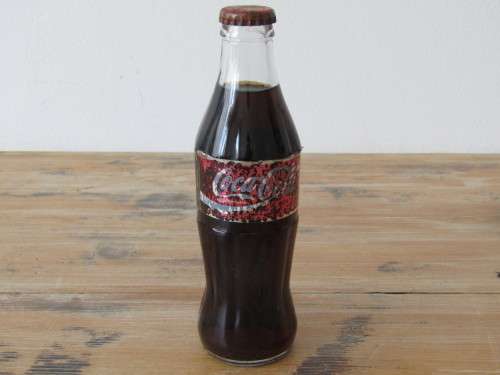 Vintage 250ml sealed Coca Cola Bottle, full
