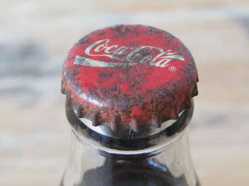 Vintage 250ml sealed Coca Cola Bottle, full