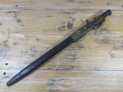 Antique Military 1907 Bayonet with leather scabbard and belt holster, makers markings, 55cm long