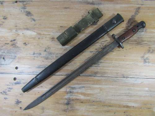 Antique Military 1907 Bayonet with leather scabbard and belt holster, makers markings, 55cm long