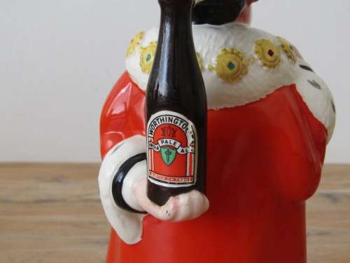 A humerous Beswick Character toby Jug "Behind every great Man", large 23cm
