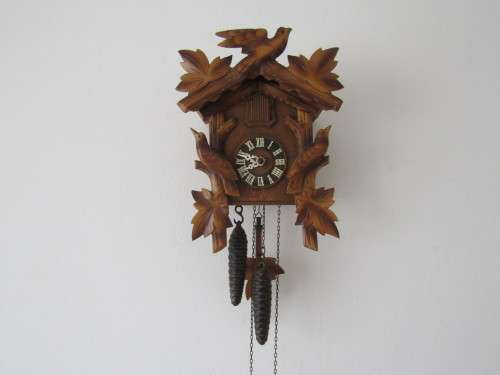 Vintage wall mounted wooden mechanical Cukoo Clock with Weights and Pendulum, made in Germany