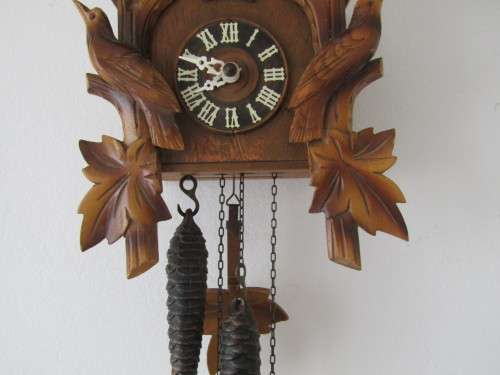 Vintage wall mounted wooden mechanical Cukoo Clock with Weights and Pendulum, made in Germany
