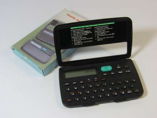 Vintage Travel Master, world time, calender, clock, conversions, alarm, etc., mint and working