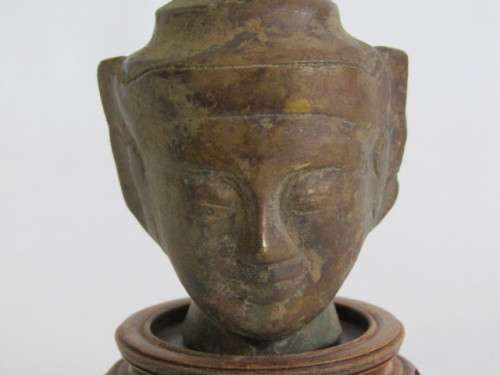 Very old Burmese Bronze Buddha Head on wooden Stand in excellent and aged condition, 13cm tall