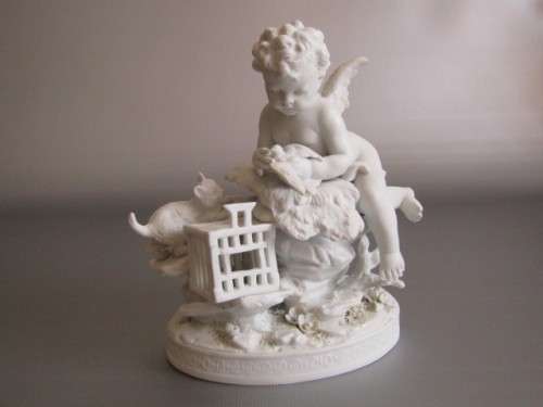 Vintage lot of 2 Porcelain Figurines; Angel with Bird and Cat, 13cm, Cherub holding flowers, 14cm