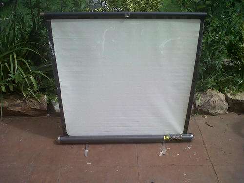 OLD ENSIGN PROJECTOR SCREEN