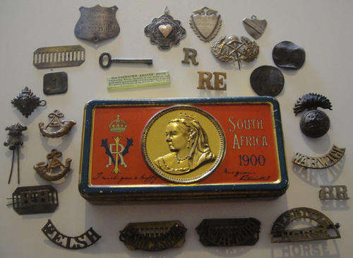 Anglo-Boer War Chocolate Box of 1900 with various badges (some silver) and odds and ends
