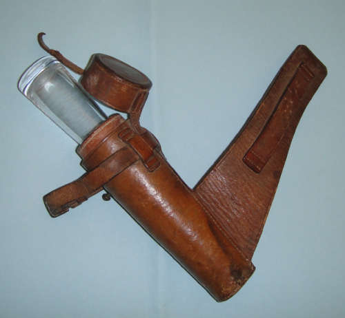 A Sterling Silver mounted spirit bottle of tapering form in leather pouch (Birmingham 1883)