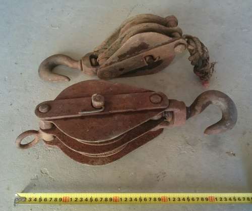 two old steel pulley's