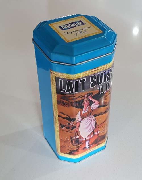 NESTLE tin as per photos