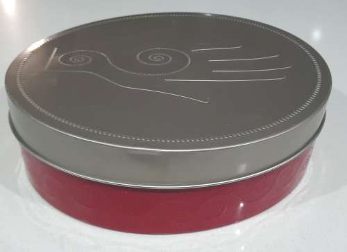 Red and silver tin as per photos